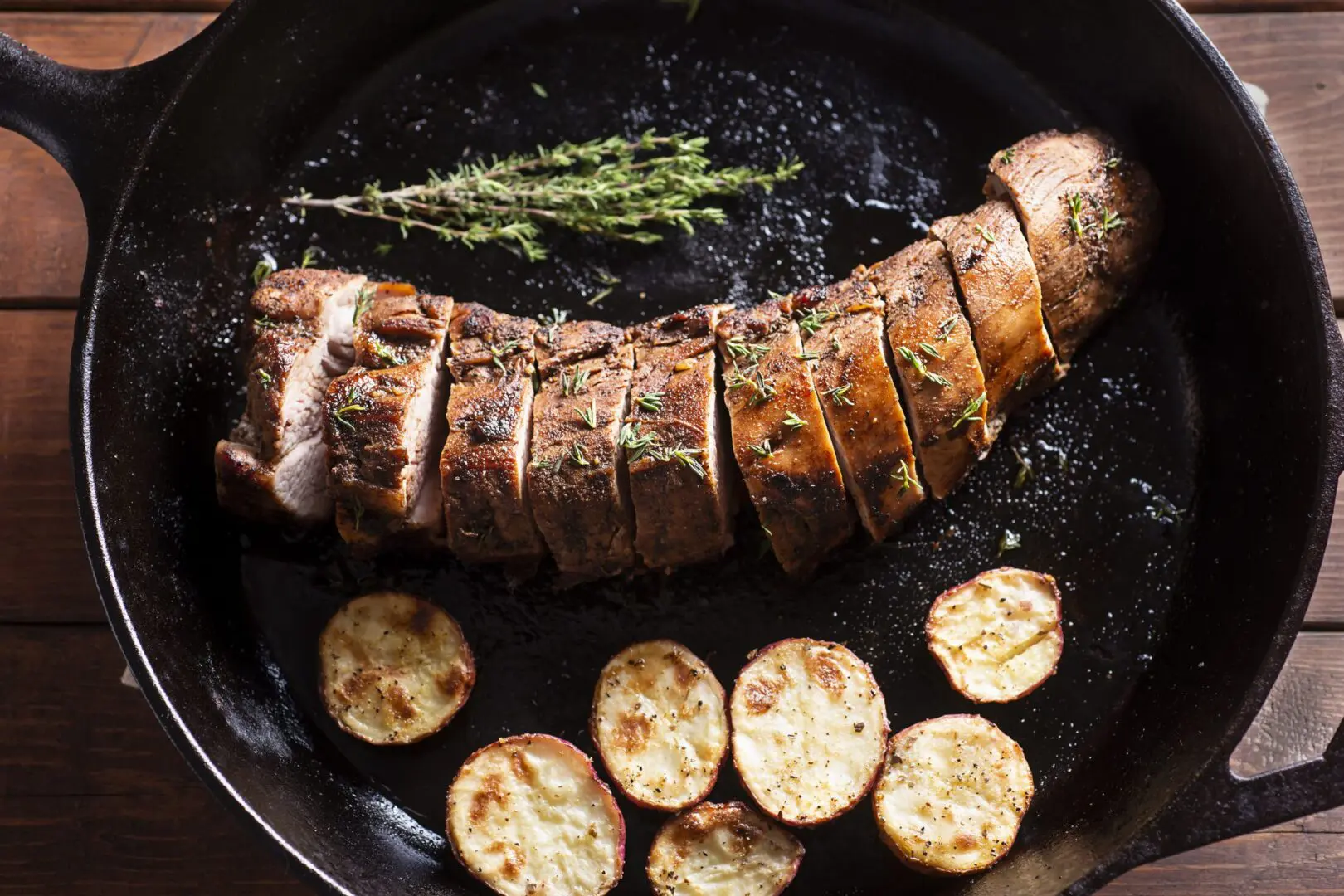 Sliced roasted pork tenderloin with roasted potatoes