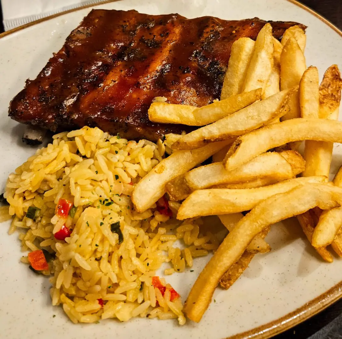 BBQ ribs with fries and seasoned rice
