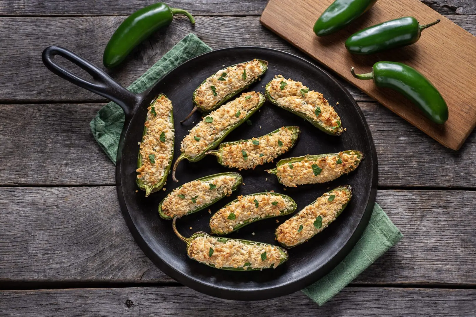 Skillet of baked stuffed jalapeño poppers
