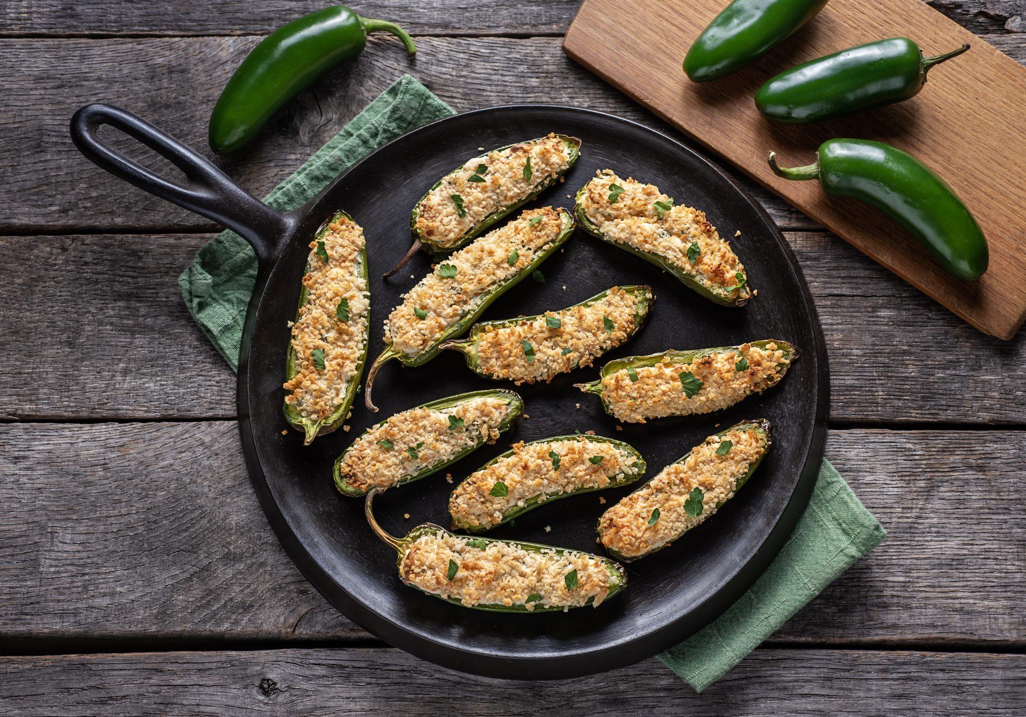 Skillet of baked stuffed jalapeño poppers